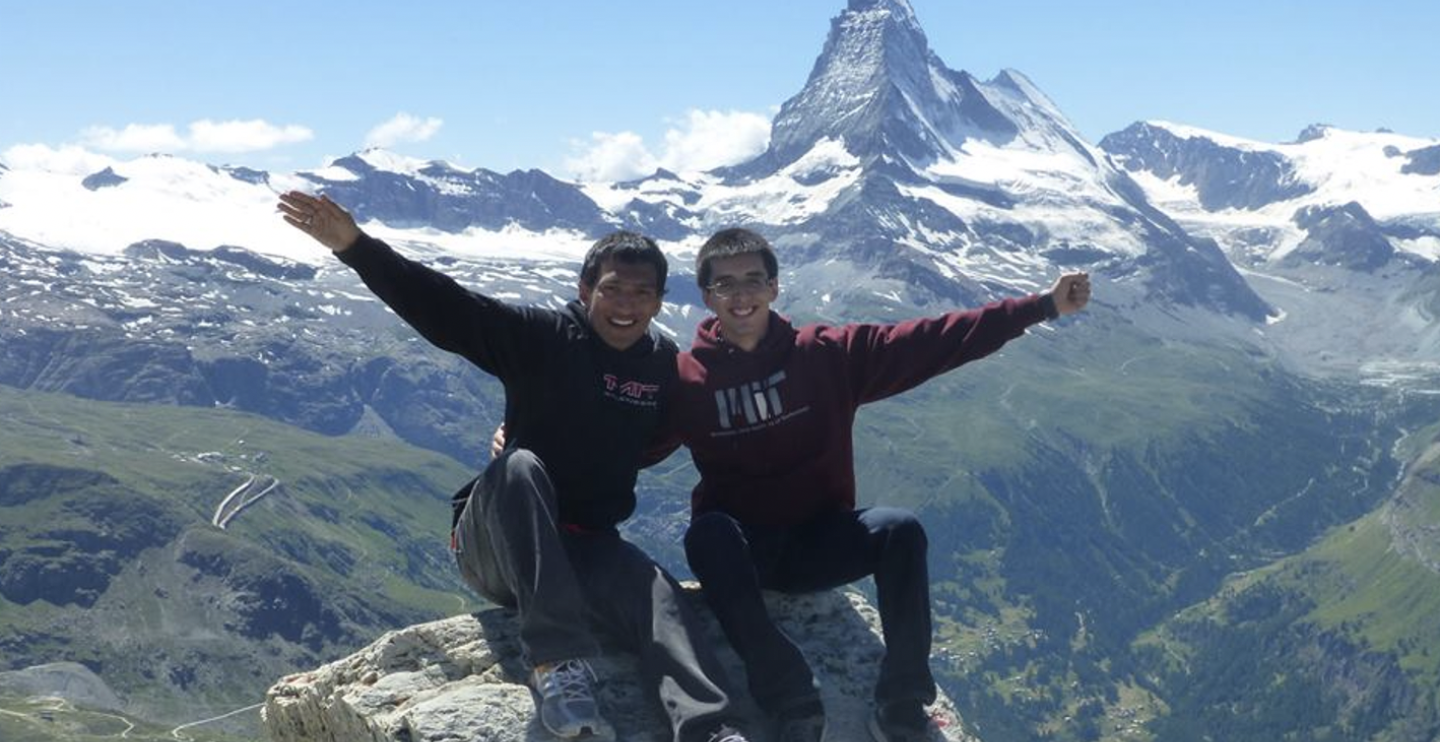 Two student interns on top of a mountain