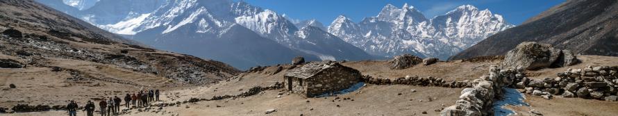 Scenic picture of Nepal mountains covered snow and a gravel path