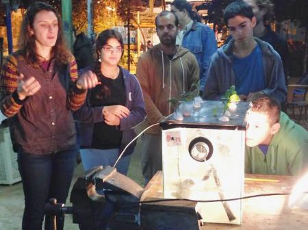 Students learning in greenhouse