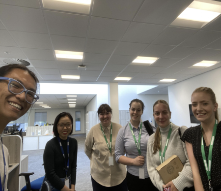 Colleagues in an office smiling